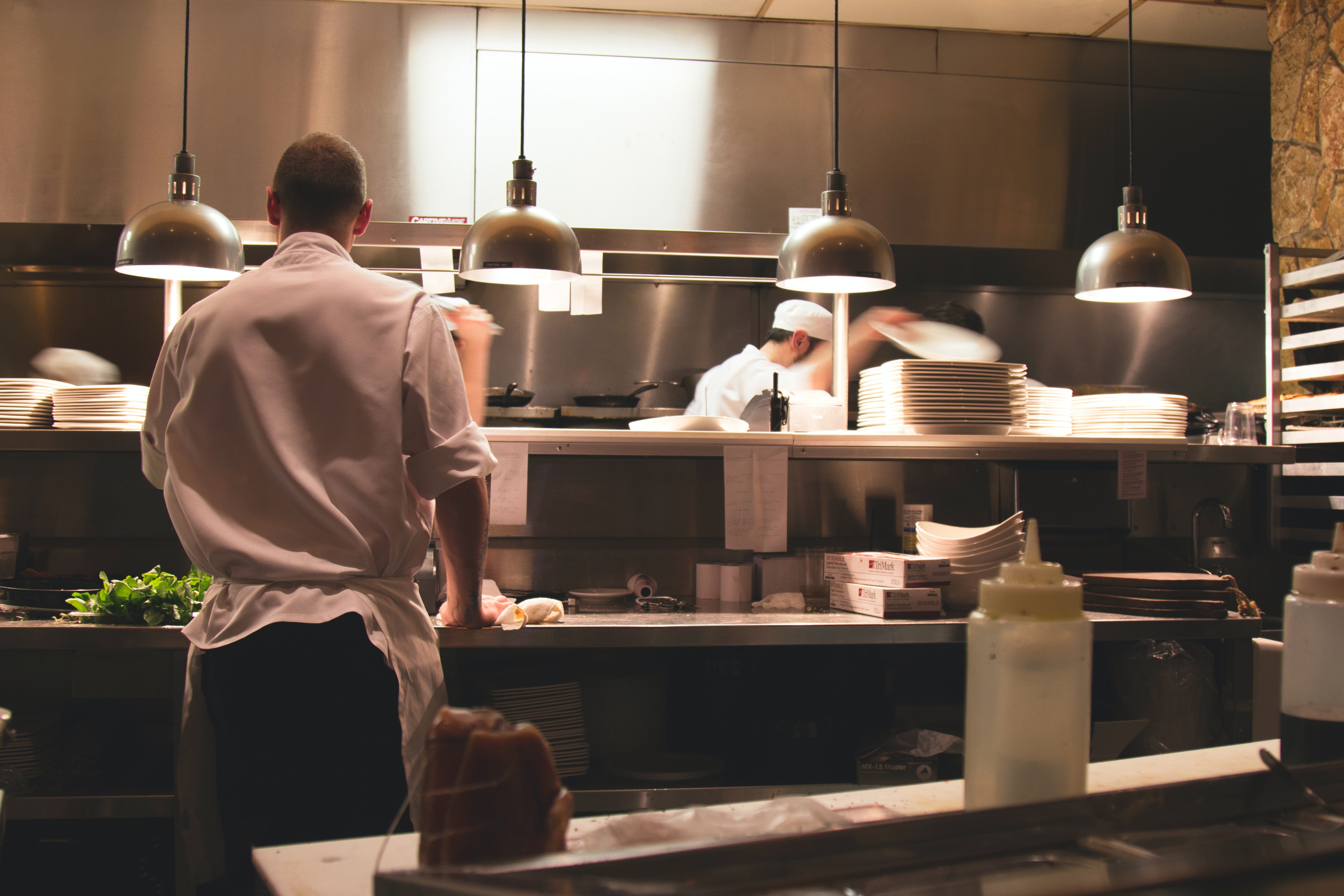 Two cooks in a restaurant kitchen